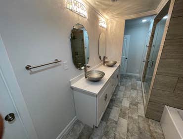 Bathroom Renovation Went down to the studs and rebuilt 2.5 baths. All plumbing, tile, sheetrock, electrical, flooring and hvac work was completed by o