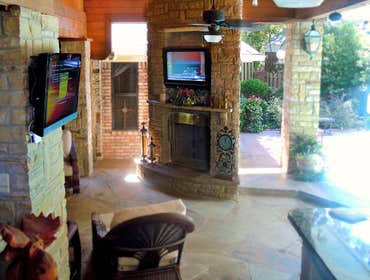 Outdoor TV's & Speakers This is an outdoor living area we did consisting of 4 speakers surrounding the pool, 4 speakers under the covered area, TV's mo