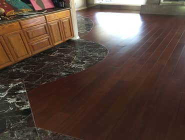 African Mahogany Sapele 1/2" x 5" African Mahogany Sapele Engineered Hardwood. Installed Flush to tile flooring.