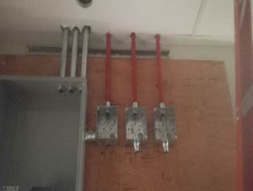 commercial building pipe installation Pipe installation for a commercial store, ran pipes for power, lighting, fire and safety devices.