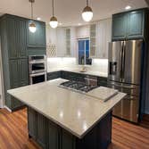 Kitchen Remodel Complete kitchen makeover. Redesigned the layout and installed new cabinetry with an island and undercabinet lighting.