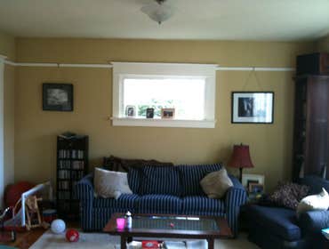 Shamburg Heating LLC Project Before and after a fireplace installation with mantle and cabinets.