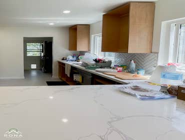 Torrance Kitchen Remodel We turned this Torrance kitchen into your warm, inviting haven! Imagine light wood cabinets with black handles, paired with wh