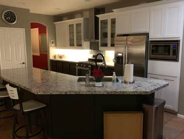 Kitchen Remodel with Painted Cabinets This kitchen has been full painted, doors replaced with new style, quartz countertops, as well as a custom built 
