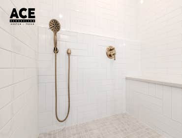 Pop of Blue Bathroom This bathroom remodel brings timeless elegance with a fresh, modern twist. The centerpiece is a spacious walk-in shower, featuring