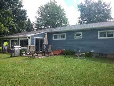 Kingston - Full Exterior All new Siding, Capped Windows, Exterior Sheeting, Soffit and Fascia. Also rebuilt rear porch to have an overhang to eliminate