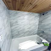 Photos by Happy Hammers Construction #3 Bathtub was replaced, remodeled the plumbing and wall tile installed.
