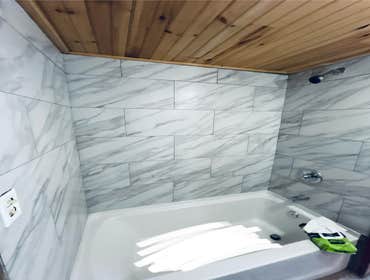 Photos by Happy Hammers Construction #3 Bathtub was replaced, remodeled the plumbing and wall tile installed.