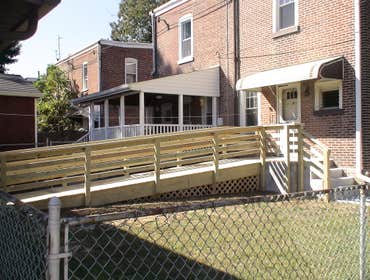 Handicap Ramp Project required the removal of an existing ramp and railing which than was replaced with the construction of a new ramp and railing. Als