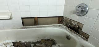 Photos by Mr Honey Do Home Improvement LLC #1 removed existing loose tiles with favorable site conditions. Removed water damaged drywall. Cleaned tiles