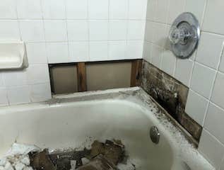 Photos by Mr Honey Do Home Improvement LLC #1 removed existing loose tiles with favorable site conditions. Removed water damaged drywall. Cleaned tiles