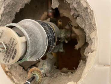 Shower Valve Replacement @Repair Opened back wall, replaced the valve and spout, repaired the back wall.