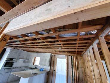 Photos by Service Restoration Pros LLC #1 A tree fell through the roof of this 3 bedroom house during Hurricane Ida. It left several gaping holes and a