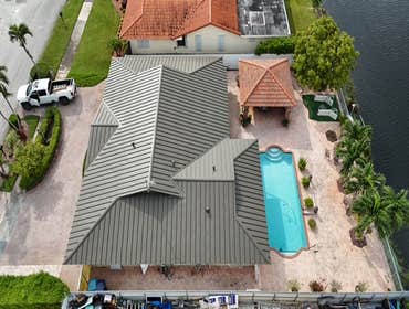 Photos by Gold Star Miami Corp #1 metal roof panels all are . 25 years warrantee