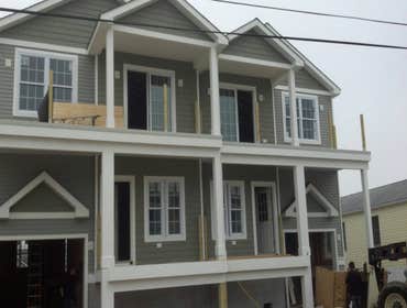 Photos by Teagan Homes #1 New construction of two townhomes sold to individuals for about $450000 each unit. Profit margin was over $250,000 in less th