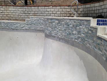 Photos by Pro Rank Pools #2 Stacked Stone with Mini Pebble finish