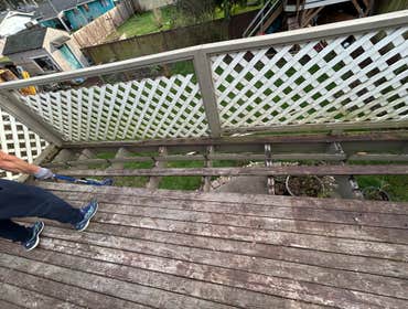 Removing all deck boards and railing.