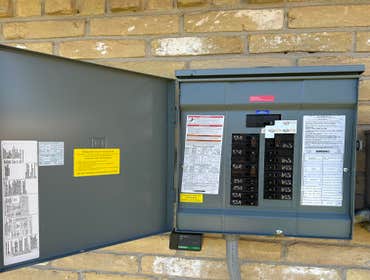 Photos by Quick Connect Electrical Solutions #1 Replacement of an exterior panel box. 100 Amp with an added Inlet box and Intelock kit.