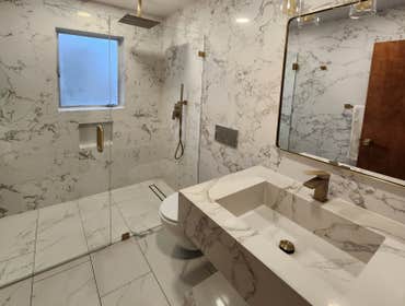 Custom Stone by Vs Integra Construction We provide custom stone work, which includes custom sinks, fireplace, tv surrounding, wall, wallpaper and more 