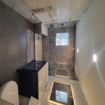 Photos by D&a Home Improvement Nyc Inc #1 Complete bathroom renovation. Replacing tub for standing stall and relocation of all plumbing.