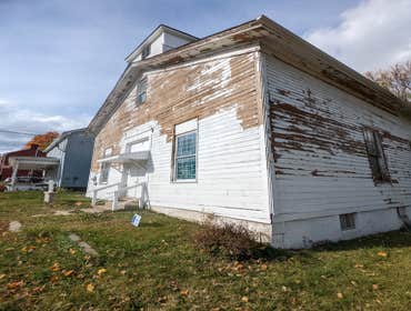Photos by High Premium Painting LLC #4 Pressure wash all the loose paint chips. Caulking and water to seal in the areas that were scrapped. After scrap