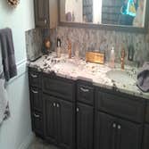 GRANITE VANITY SET ON NEW CAB.