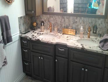 GRANITE VANITY SET ON NEW CAB.