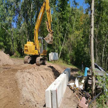 Photos from Fischer Brothers LLC Installing a concrete block retaining wall