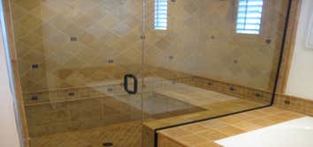 Project photos from RCL Construction Company, Inc Windswept Way Project - Master bathroom remodel with travertine stone tiles and oil-rubbed fixtures.