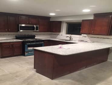 Photos by J. Roberts Installations #6 kitchen remodel with new cabinets and appliances along with a tile floor