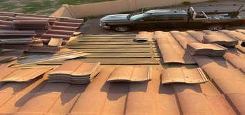 Photos by Jilek Roofing #1 Removed tiles above roof leak area. Replace roof tile underlayment and replace roof tile.