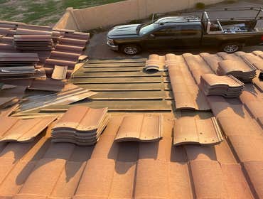 Photos by Jilek Roofing #1 Removed tiles above roof leak area. Replace roof tile underlayment and replace roof tile.