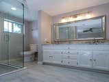 Baggett Bathroom (Before and After) This bathroom was designed in the 1990's. We redesigned the Master Bathroom with an open concept and clean lines. I