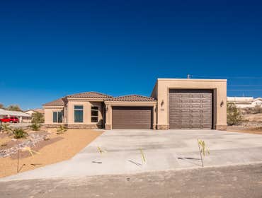 3390 Desert Dr, Lake Havasu City MEGA GARAGE! Here it is, a brand new home with DOUBLE RV GARAGE located on a corner lot with plenty of room! Large ope