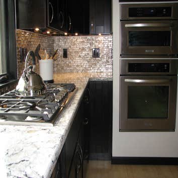 Mocha Shaker Kitchen Cabinet Makeover This kitchen makeover used our Mocha Shaker kitchen cabinets. These sleek, modern kitchen cabinets combined with 