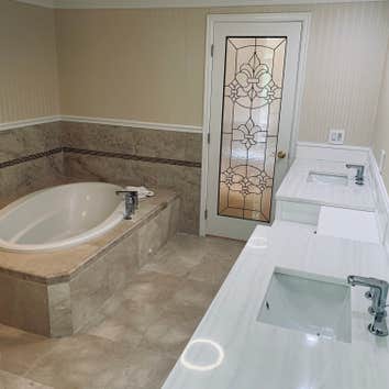 Bathroom - marble tiling, cabinet & tube installation, paint