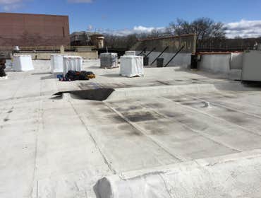 Flat Roof Work Before & After Picture of a flat rubber with major leaks.
