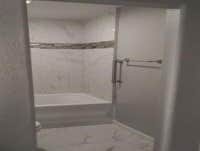 Photos by Top Notch Construction, LLC #1 Demolition for primary bathroom, enlarge door (handicap accessible), remove closet to increase space, install 