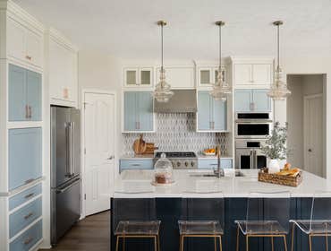 Shades of Blue Transforming spaces is what we do. This home’s finishes were stuck in the 90s with rouge-stained cabinets, Giallo ornamental gold granit