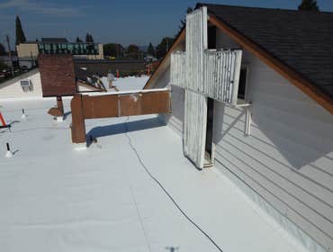 Isaac Roof Construction Commercial Roof Project Flat roof replacement with a minimum R-value of R-30 and a Class A Fire rating.