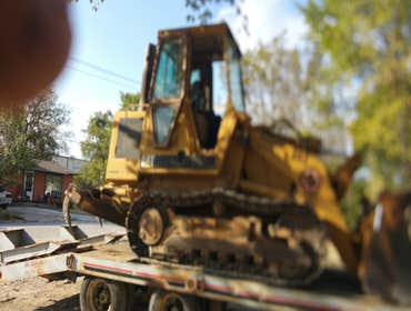 Track loader removes concrete
