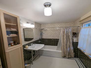 Spadina Bathroom Welcome to our Vintage Bathroom Remodel, where history and modern craftsmanship meet. This bathroom, untouched since 1954, was fully r