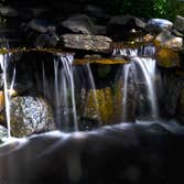 Scarsdale Waterfall by MG's Lawn Green Inc This is a waterfall that MG's Lawn Green designed and installed for a homeowner in Scarsdale, NY.