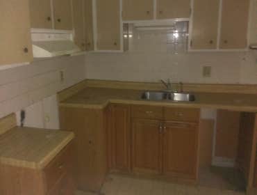 Kitchen remodel Full home rehab. This kitchen was re-finished very affordably. We only used new paint and new hardware!