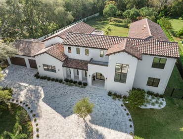 Tampa Bay Custom Home This 10,000-square-foot custom home brought our clients’ lifelong vision for a Mediterranean-inspired residence to life, combinin