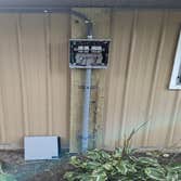 Photos by Kenan J Giroux #1 Installation of 16 kW roof mounted solar array on detached horse barn with 300 ft trench, back to house into junction box a