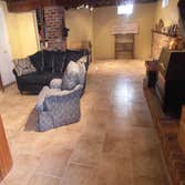Basement tile floor 600 sq. ft. 18X18" tiles offset pattern. Flooding destroyed floating floor in this basement. Installed 18" porcelain tiles offset 