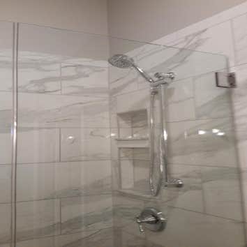 Photos by Custom Kitchen and Bath Works, Inc. #1 Two bathroom remodeling project.
Master bathroom shower, tile floor, and wood trim.
Hall bathroom sh