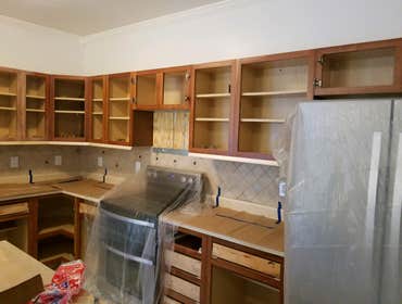 Photos by From the Ground Up #7 Refaced kitchen cabinets and painted. Also installed recess lighting .