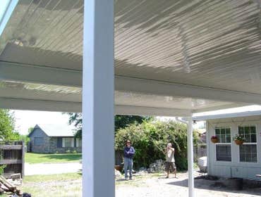 HARRIS Two Car Carport This a 20' X 20' Freestanding carport with 6 -3 x 3 14 gauge Posts set in ground with 24" concrete footings ! 20' Heavy gauge al